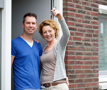 Couple happy to be able to enter their property again with new keys