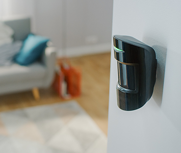 Wireless alarm motion sensor fitted to internal house room