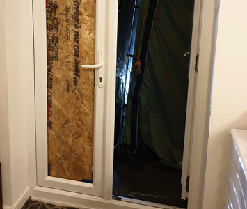 Patio doors boarded-up following an intruder
