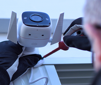 Locksmith security expert installing a CCTV system