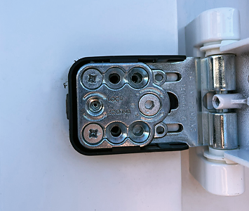 Inside a uPVC door hinge