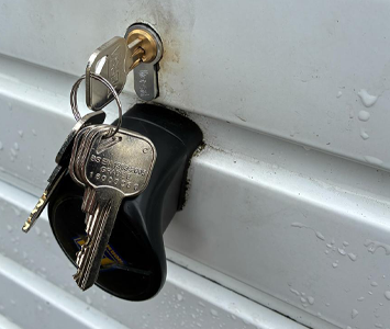 Garage door featuring a new replacement lock