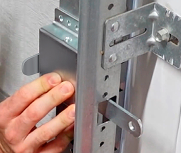 Garage door side latch locking mechanism