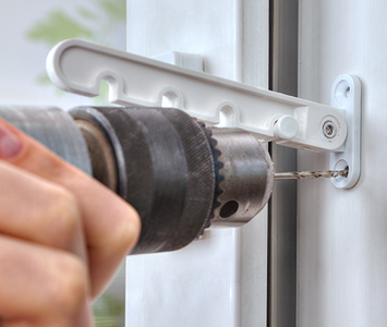 Locksmith installing new window adjusters