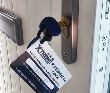 Door featuring a high-security 'Xtreme Federal' lock with key identification tag