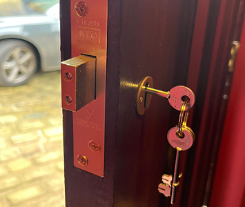 Wooden door with new lock and key